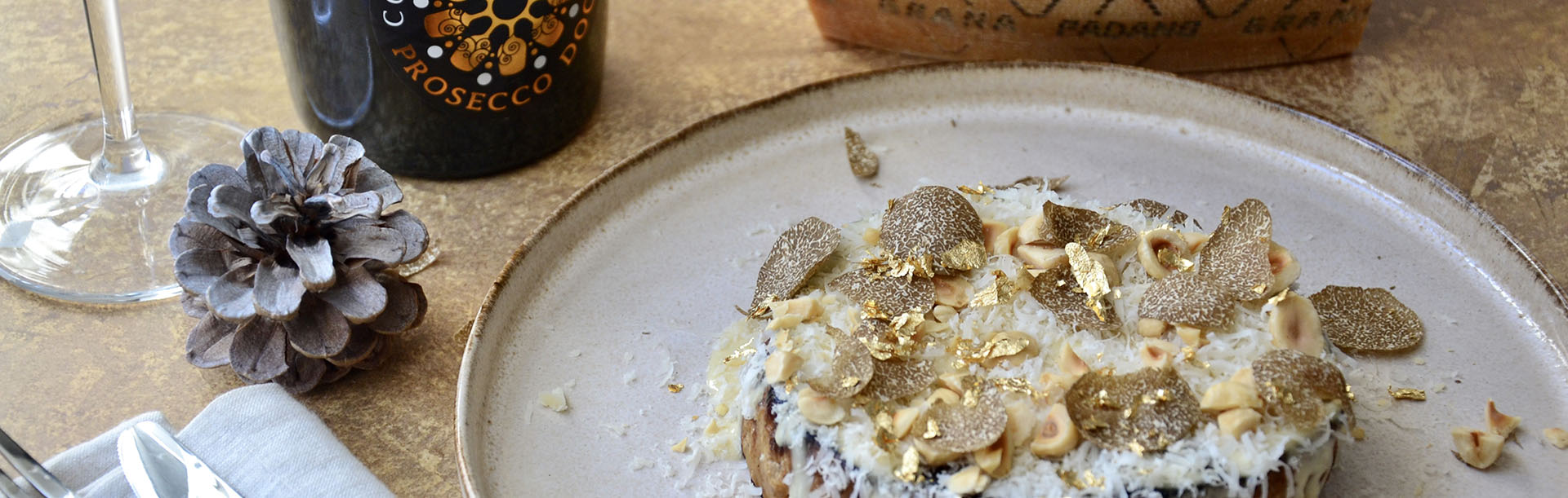 Roast celeriac with Prosecco DOC and Grana Padano sauce, truffle and hazelnuts | Consorzio Tutela Pr
